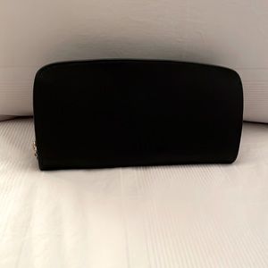 Coach large zip around wallet. A gift that was never used.